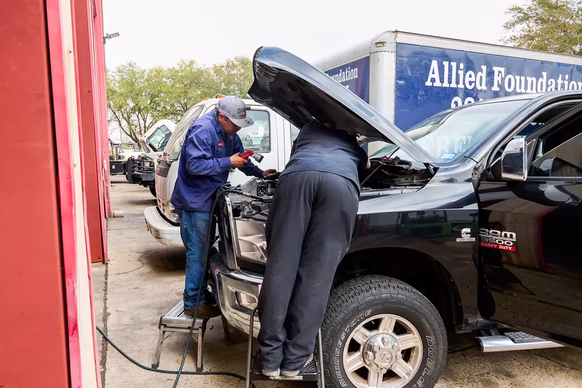 Diesel mechanic performing DOT inspection